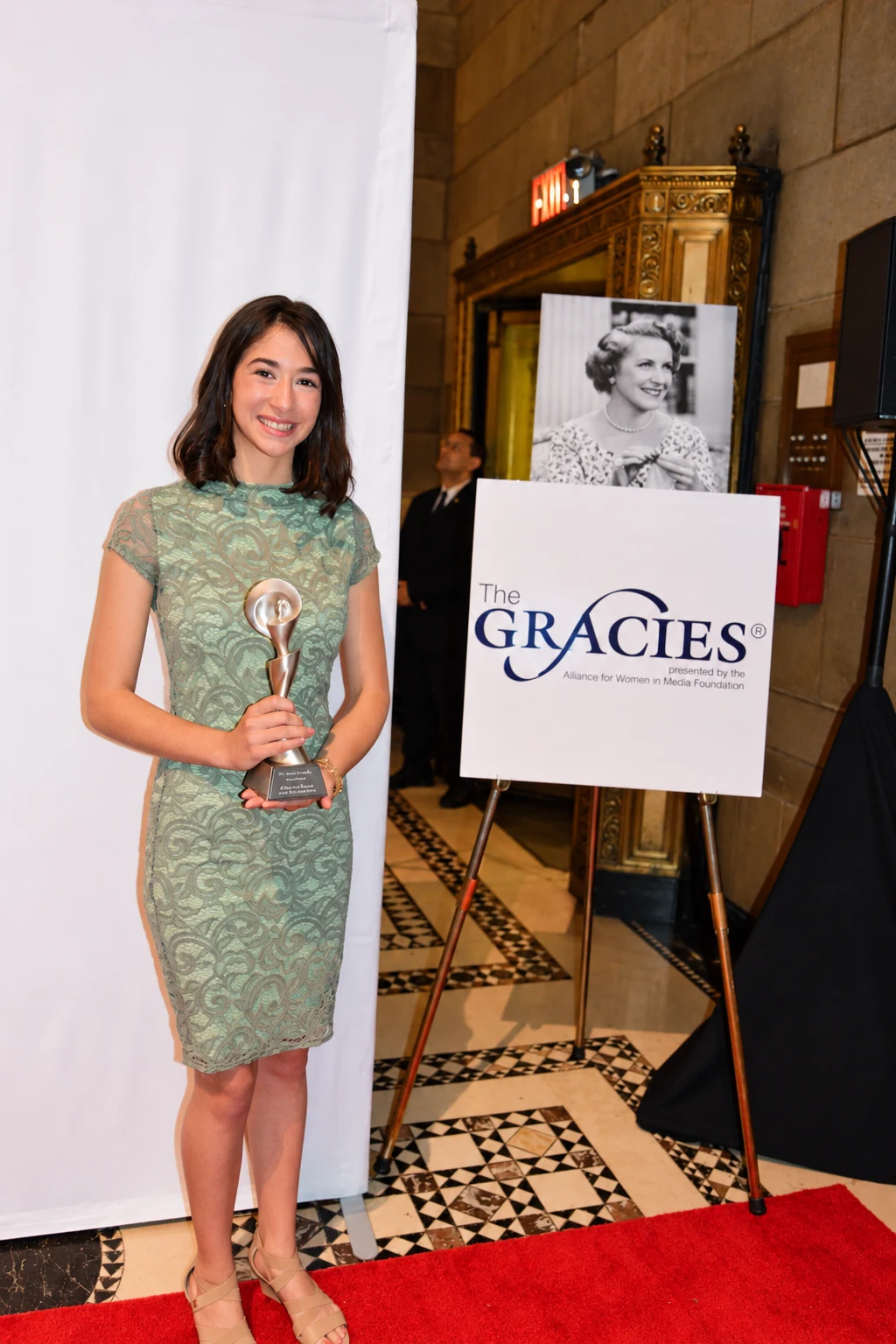Victoria holding her Gracie Award