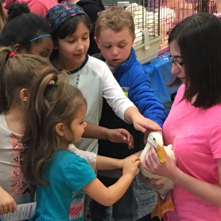 Victoria at Islip Library with Cato and children